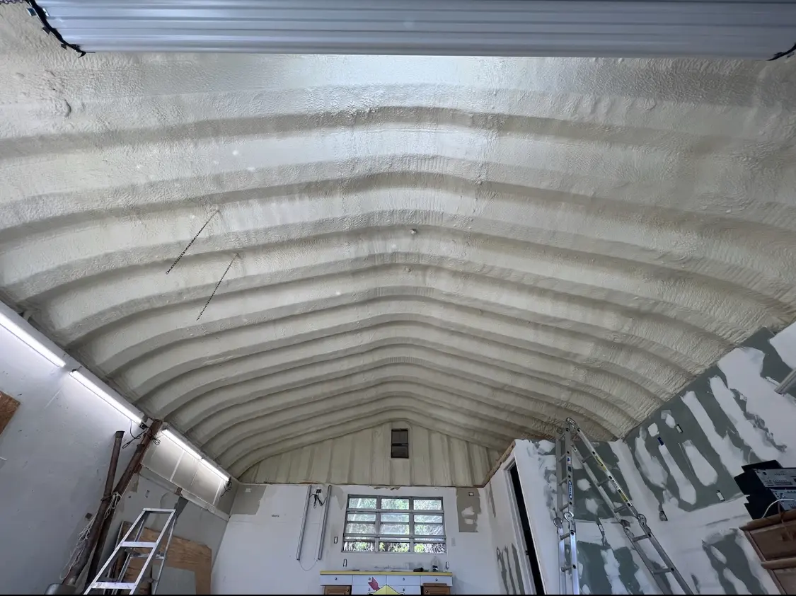 Spray polyurethane foam applied to the underside of a metal roof deck in Hasbrouck Heights